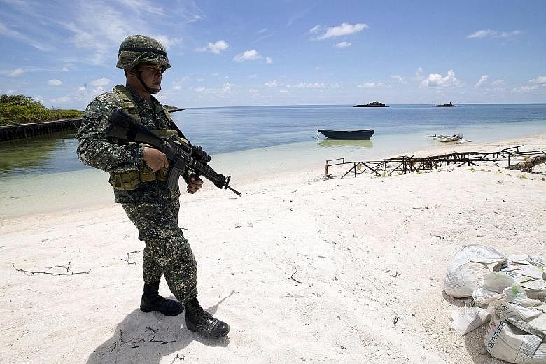 A Filipino soldier on Thitu Island in May 2015. Mr Duterte wants more barracks to be constructed on top of plans to build a new port, repave an airstrip and repair existing structures there.