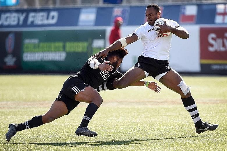 Joeli Lutumailagi (right) of Fiji tries to avoid a tackle from New Zealand's Vilimoni Koroi during the USA leg of the World Rugby Sevens Series. Fiji went on to reach the Cup final in Las Vegas, where they lost to South Africa.
