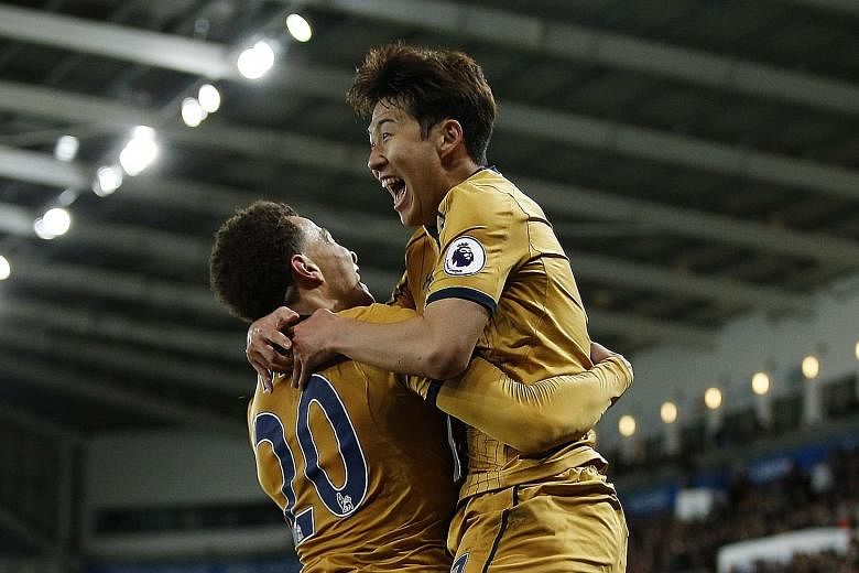 Left: Tottenham's Son Heung Min celebrating with Dele Alli after putting his side ahead in added time against Swansea City.