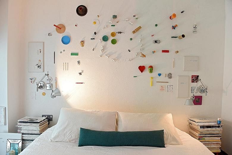 A wall in the master bedroom (above) features about 60 items, each holding a memory of six-year-old Trevi, daughter of Mr Dennis Cheok and his wife, Maggie.