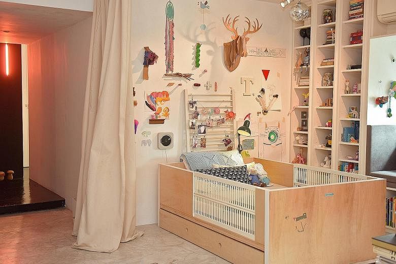 The child's bed (above) is built by Mr Cheok using plywood and fitted with slats from her baby crib.
