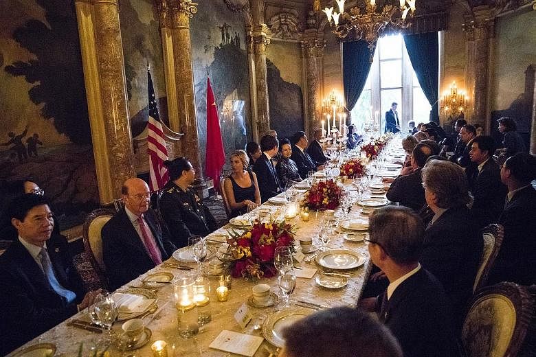 Members of the Chinese and US delegations at a dinner for Mr Xi Jinping, hosted by Mr Donald Trump, in a private room at the US President's Mar-a-Lago resort in Palm Beach, Florida, on Thursday.