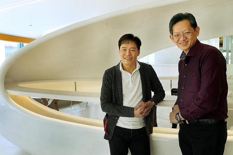 DeClout's chief executive Vesmond Wong (far left) and vCargo Cloud's chief executive Desmond Tay. DeClout started investing in vCargo Cloud in 2015, and now holds a 50.01 per cent stake.