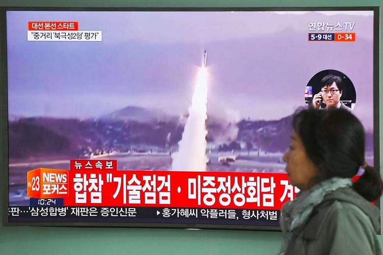 South Korea's media broadcasting file footage of a North Korean missile launch on Wednesday, ahead of a China-US summit the next day at which Pyongyang's accelerating atomic weapons programme was set to top the agenda.