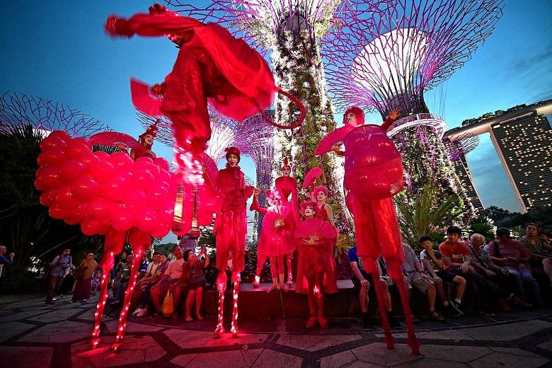 The Red Hearts (Les Rouges Coeurs) by Mademoiselle Paillette set the hearts of visitors to Gardens by the Bay's Supertree Grove thumping yesterday, with their pulsating action on stilts, as they kicked off this year's Voilah french festival. Organise