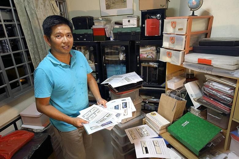 Avid Singapore postage label collector Poh Kian Hwee with his collection at his home in Bukit Merah. He has been collecting labels long enough to see improvements in paper and print quality through multiple generations of SAM kiosks.