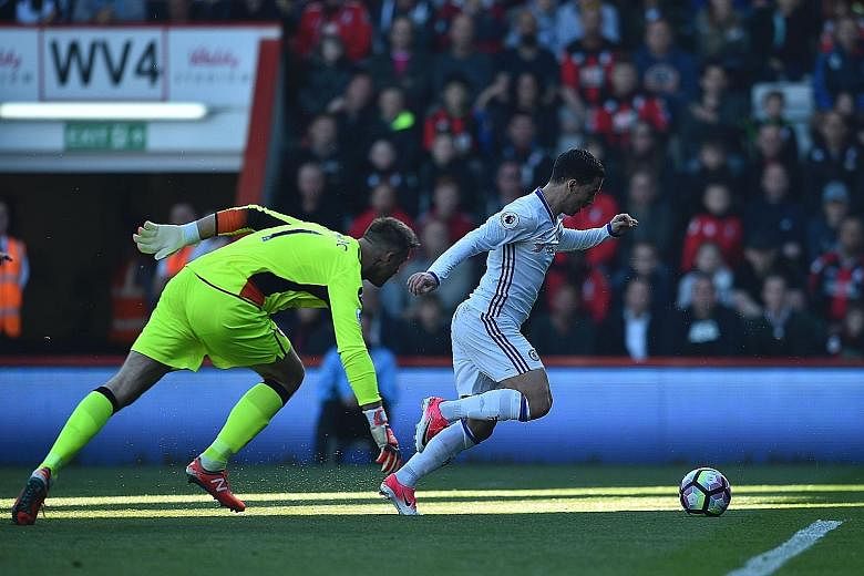 Chelsea midfielder Eden Hazard rounding Bournemouth goalkeeper Artur Boruc in the 20th minute to score their second goal. The Blues ran out comfortable 3-1 winners, and will next face Manchester United.