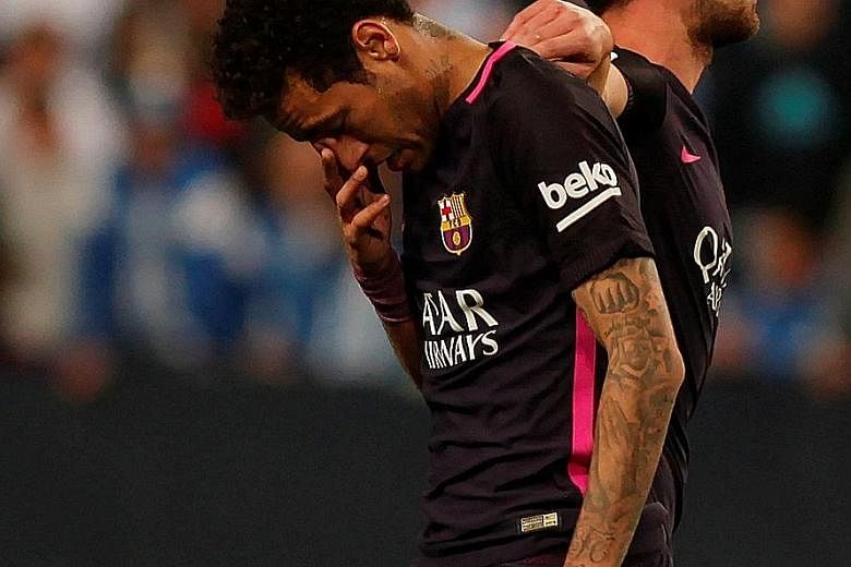 Barcelona forward Neymar trudging away, having been sent off in the 65th minute of their shock 0-2 loss to Malaga. Worse could follow for Barca, with the league looking into his behaviour following the red card, which could see him miss the 'Clasico'