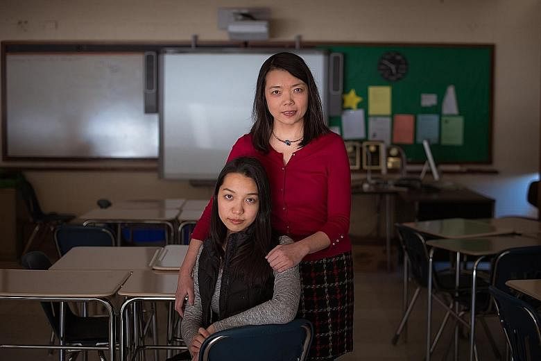 Lexington High School senior Emily Zhang with her mother Melanie Lin. Both of them have experienced pressure - Emily over having to succeed in school, and Ms Lin over her obsession with her daughter's grades.