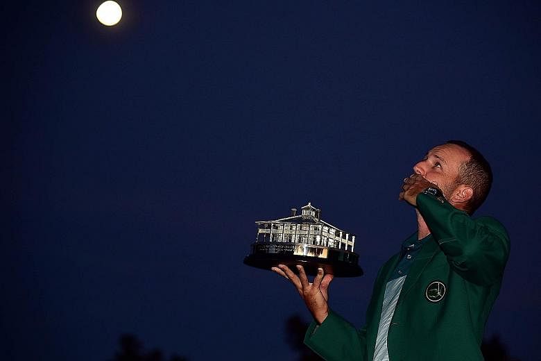 Looking to the skies and blowing a kiss to his late compatriot Seve Ballesteros, Sergio Garcia of Spain celebrates with the Masters Trophy after defeating Justin Rose at the first play-off hole. Garcia was the only player in the 93-man field to shoot