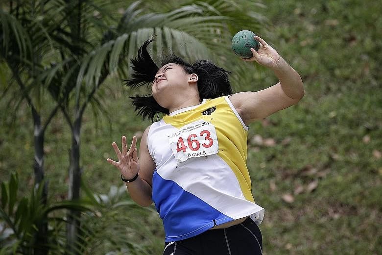 NYGH student Jasmin Phua setting a new mark in the B Division Girls' shot put with a record throw of 12.73m. The 16-year-old broke an 11-year-old record in the process.