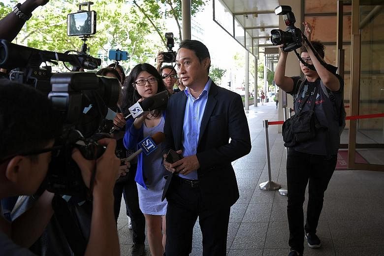 City Harvest Church (CHC) founder and senior pastor Kong Hee (centre) leaving the Supreme Court last Friday with his lawyer, Mr Edwin Tong, in front of him. Kong has said through his lawyer that he will study the filing by the Attorney-General's Cham