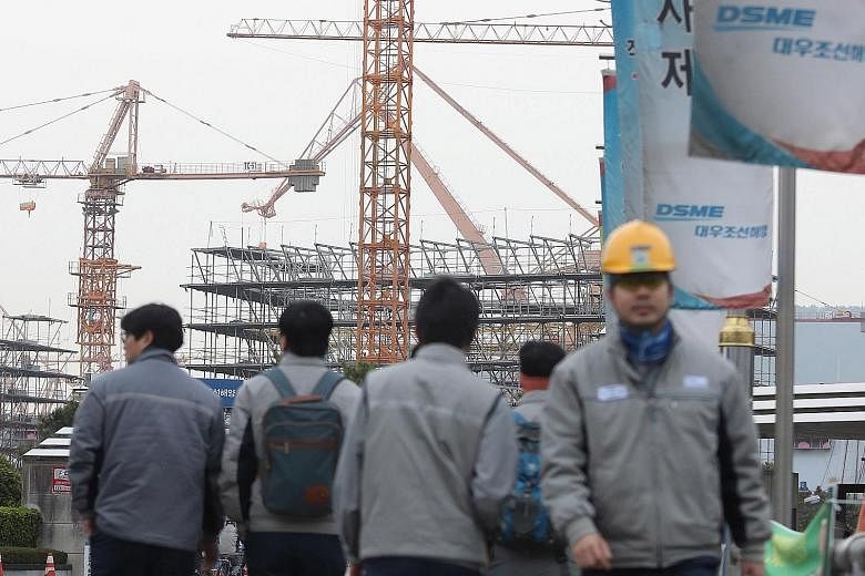 A Daewoo Shipbuilding & Marine Engineering shipyard in Geoje, South Korea. Daewoo said it had 14.4 trillion won (S$17.6 billion) of debt and 224.3 billion won in cash and equivalents as of December.