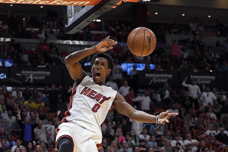 Miami Heat's Josh Richardson dunks during the 124-121 victory against the Cleveland Cavaliers at American Airlines Arena. Richardson, a second-year guard, has taken on much of the burden in the prolonged absence of starting guard Dion Waiters, who ha