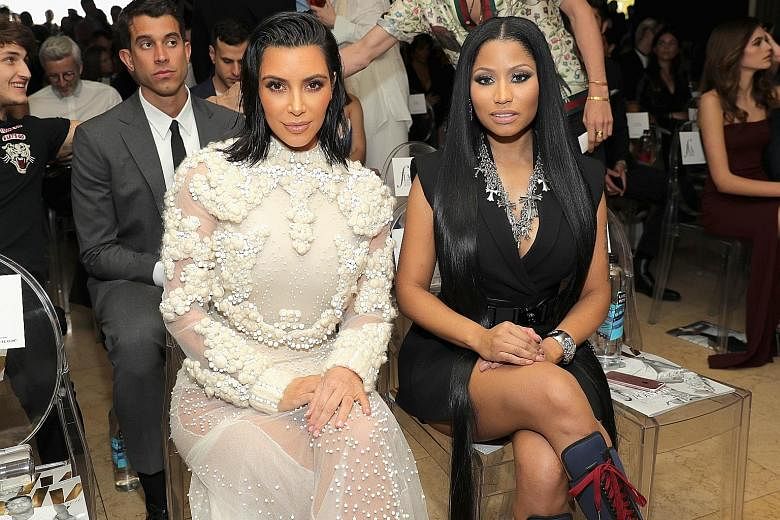 From left: Reality television star Kim Kardashian West and singer-songwriter Nicki Minaj sporting spiky eyelashes; Adele's trademark dense fluffy eyelashes channel retro glamour.