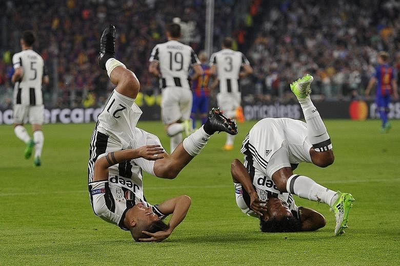 Juventus forward Paulo Dybala (No. 21) celebrating his 7th-minute opener with winger Juan Cuadrado. Dybala capped off a stellar night with a brace against Barcelona, leaving the LaLiga giants teetering on the brink of a Champions League quarter-final