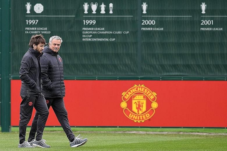 Manchester United manager Jose Mourinho (right) plotting his side's tactics ahead of their Europa League quarter-final against Anderlecht. The Europa League winners will be guaranteed a Champions League berth.