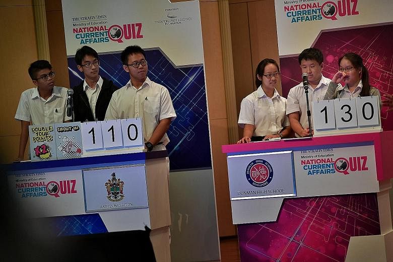(From left) Raffles Institution's Team A comprising Danial Asyniaf, 17; Nelson Ooi, 16; and Jared Foong, 17; and the winning Dunman High School team comprising Joy See, 17; Ryan Lim, 16; and Sheena Lim, 16. St Andrews Junior College also fielded a te
