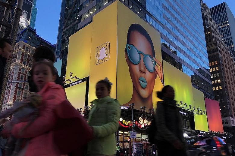 A Snapchat billboard in Times Square, New York. Parent firm Snap is among the companies that have drawn criticism for using the dual-class share structure because of corporate governance concerns.