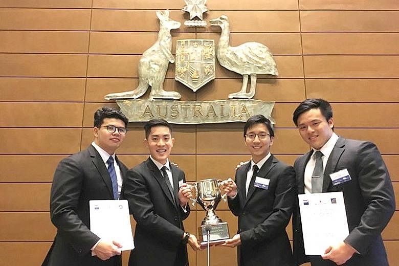 Singapore Management University students (from left) Pang Weng Fong, Gary Leow, Benedict Chan and Goh Yong Ngee with their championship trophy after winning the inaugural Ian Fletcher International Insolvency Law Moot Competition, held in Sydney, Aus