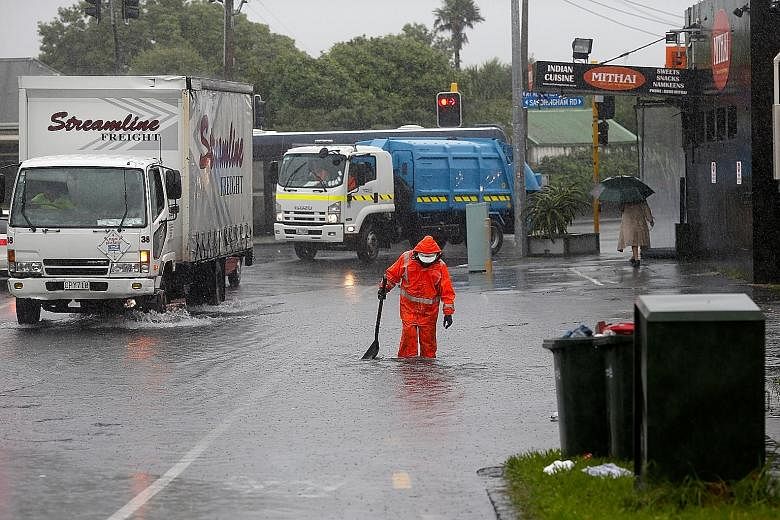 Parts of Mt Albert Road in Auckland were flooded on Wednesday. Despite a weather warning for the city as Cyclone Cook approached, "it seems Auckland has largely survived... unscathed", its mayor tweeted.