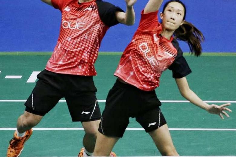 Singapore's Terry Hee and Tan Wei Han taking China's All England champions Lu Kai and Huang Yaqiong the distance in their Singapore Open round of 16 clash at the Singapore Indoor Stadium. 
