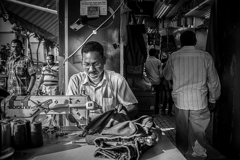 Junior college student Jewelle Woo's shot depicts how people cross the road in Little India; and Institute of Technical Education student Khairul Arifin's work on the people who work and live in the area includes one of a long-time tailor (above).