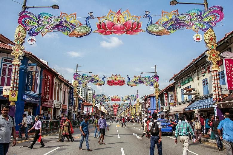 Junior college student Jewelle Woo’s shot depicts how people cross the road in Little India (above); and Institute of Technical Education student Khairul Arifin’s work on the people who work and live in the area includes one of a long-time tailor.