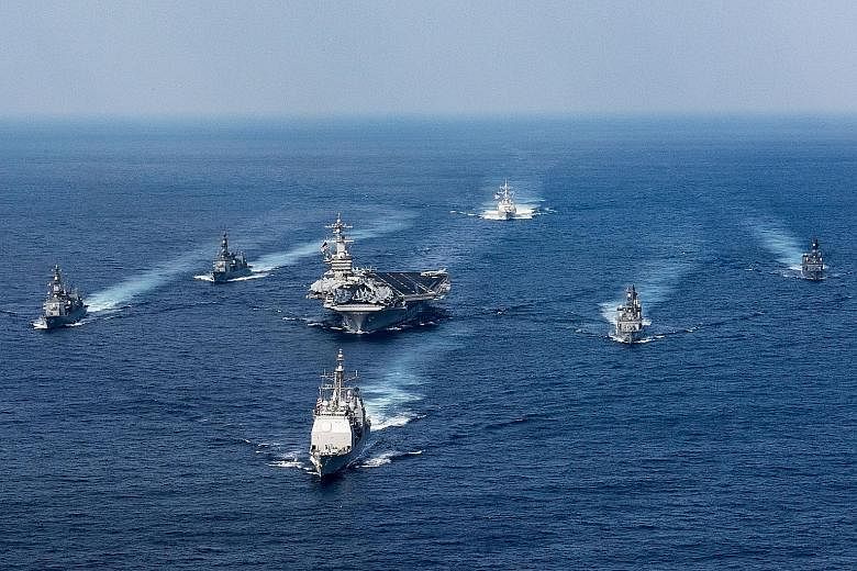 The USS Carl Vinson and other US warships with Japanese destroyers in an exercise last month. The decision to divert the US fleet from its original destination of Australia to the Korean peninsula is no light matter, says the writer. It is conceivabl