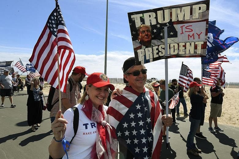 A rally for US President Donald Trump last month in Huntington Beach, California. His recent policy flip-flops have soothed the nerves of many Republicans who were worried that he was looking to upend too much of the status quo, but left his most ste