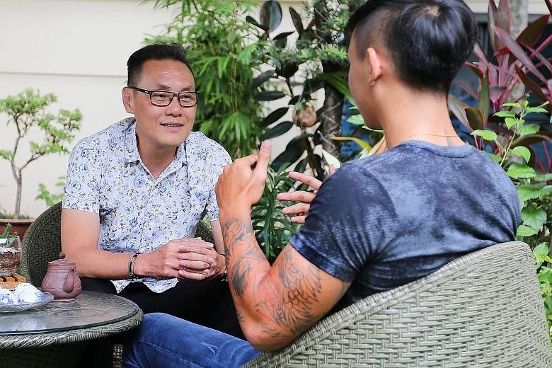 Pastor Don Wong, founder and executive director of The New Charis Mission, talking to Wilson, a resident at its halfway house, last Monday. Wilson, 19, was given 27 months' probation for drug offences.
