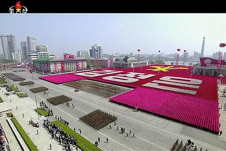 North Korea pulled out all the stops at the parade, and single-engine propeller- powered planes flew in formation over the crowds. Unlike at some previous parades attended by Mr Kim, there did not appear to be a senior Chinese official in attendance 