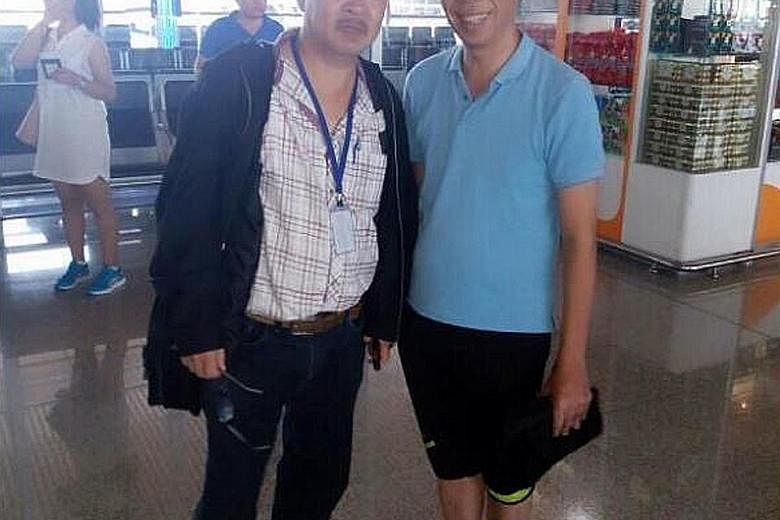 Mr Peter Chong (right) at Kuala Lumpur airport yesterday, after flying in from Thailand.