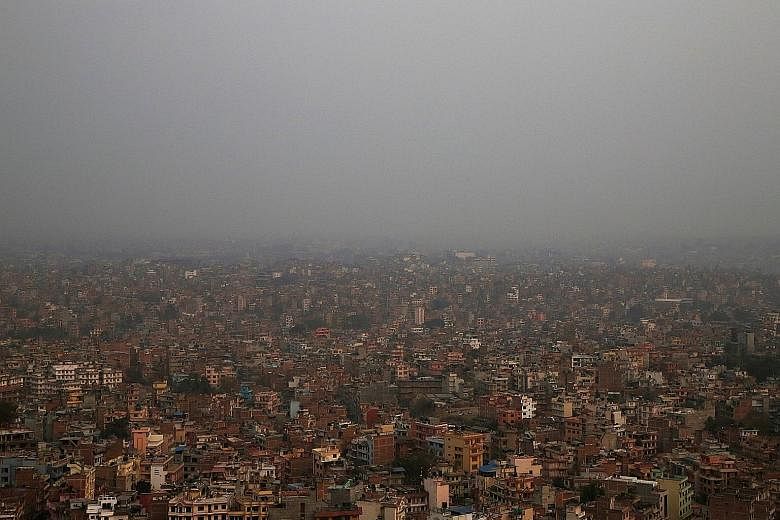 Kathmandu Valley covered in smog in February. Pollution in the city regularly reaches unhealthy levels, but proposals to tackle the problem by modernising the inefficient bus network have been stalled by transport syndicates that reportedly have infl