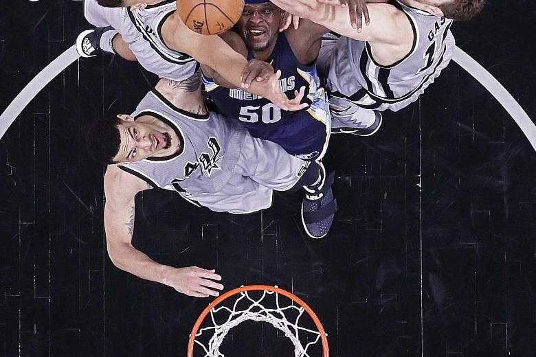 No way through for Memphis Grizzlies' Zach Randolph (centre), as he is surrounded by San Antonio Spurs' (clockwise from left) Kyle Anderson, Pau Gasol and Danny Green during their Game One clash in the NBA Western Conference play-offs. The Grizzlies 