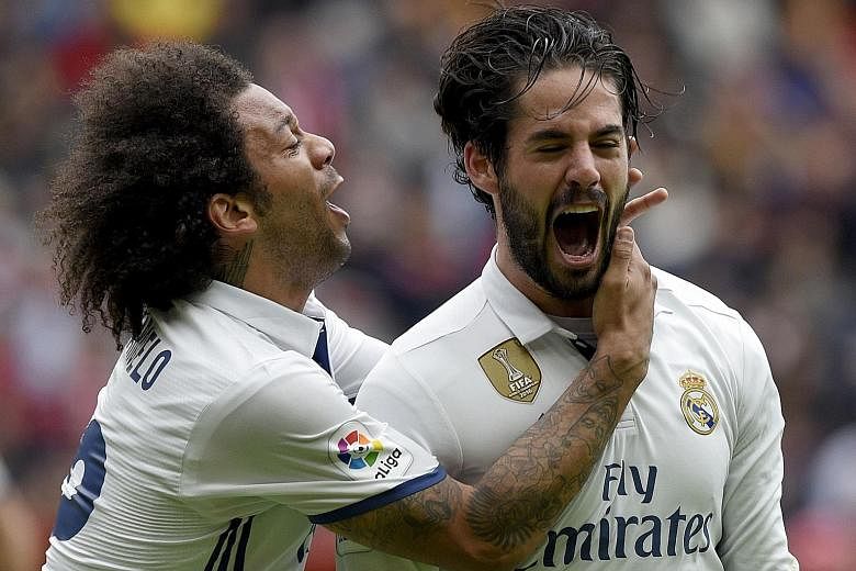 Brazilian Marcelo rushing to hug Isco after the Spaniard scored one of his two goals in Real's 3-2 win. He started only because the big names were rested for the Champions League.
