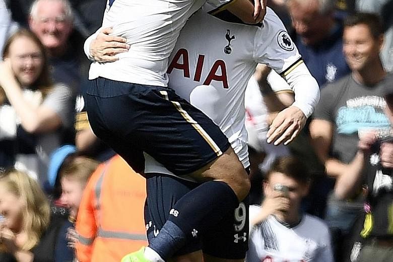 Tottenham striker Vincent Janssen celebrating his first league goal from open play against Bournemouth with team-mate Son Heung Min. With seven league wins in a row, Spurs are showing they have the mettle as the title run-in heats up.