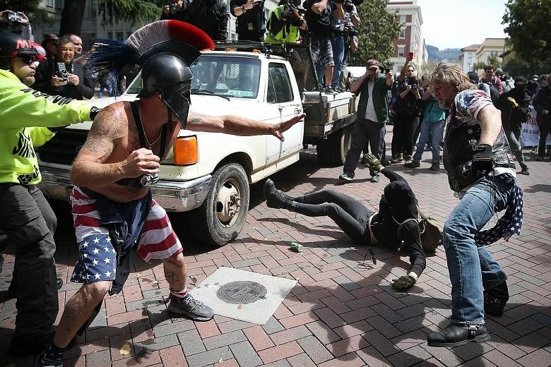 At least 20 people were arrested as rival camps clashed over Mr Donald Trump on Saturday in Berkeley, California.