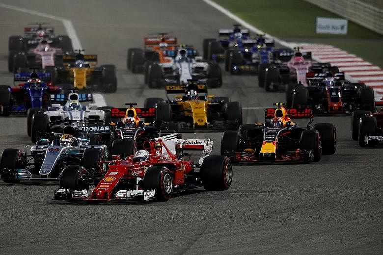 Ferrari driver Sebastian Vettel leading Mercedes' Lewis Hamilton and the rest of the pack en route to winning Sunday's Bahrain Grand Prix.