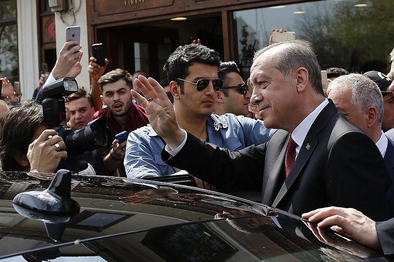 Turkish President Recep Tayyip Erdogan waving to supporters as he left Eyup Sultan mosque in Istanbul yesterday. The latest referendum was arguably his biggest ballot-box challenge since his party came to power in 2002.