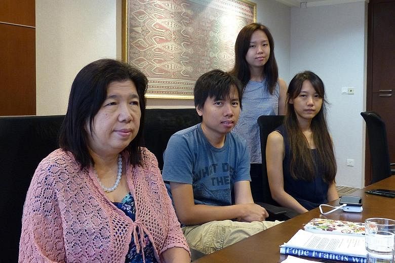 Mr Raymond Koh received a death threat in 2011 and went missing on Feb 13. His family members (from right) wife Susanna Liew, son Jonathan, and daughters Elizabeth and Ester are clinging on to hope that their patriarch is safe.