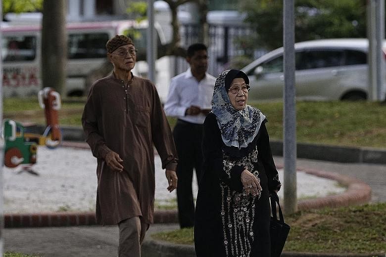 Mr Adanan Bakron and his wife Norsiah Suja'i were the first visitors to arrive at Mr Othman's home early yesterday morning to pay respects to their former neighbour and long-time friend.