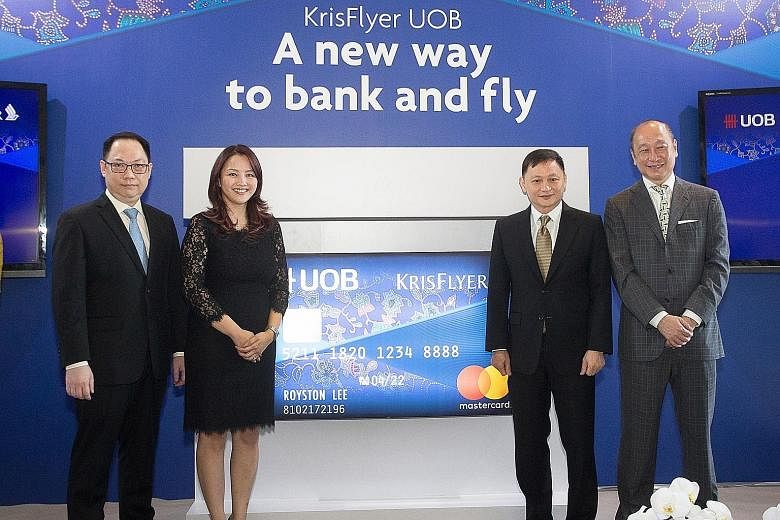 (From left) Mr Tan Kai Ping, senior vice-president of marketing planning, Singapore Airlines; Ms Jacquelyn Tan, head of personal financial services Singapore, UOB; Mr Goh Choon Phong, chief executive of SIA; and Mr Wee Ee Cheong, deputy chairman of U