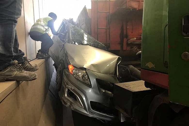 A driver escaped with minor injuries when his car was crushed by a trailer in an underpass in Tuas yesterday afternoon. The 45-year-old man was taken to Ng Teng Fong General Hospital, said police. He is understood to have suffered some cuts. The poli