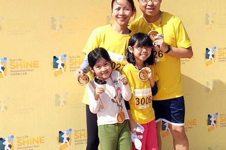 Shawn Khong, Wong Ching Ming, and their two daughters will be taking part in the ST Run, as part of their family activities.