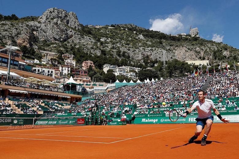 World No. 1 Andy Murray, who returned to the ATP Tour after an elbow injury, scrambling for a backhand during his 7-5, 7-5 win against Gilles Muller at the Monte Carlo Masters.