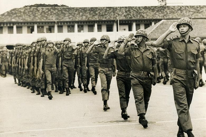 Mr Othman Wok, then a lieutenant in the People's Defence Force as well as the Minister for Social Affairs, leading the troops during a passing-out parade in 1969. Those who knew him said he was a man who, despite his stature, was respectful and humbl