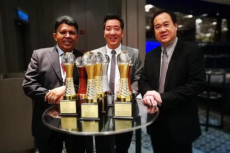 From left: SPH deputy chief executive officer Patrick Daniel, ST news editor Marc Lim and ST night editor Paul Cheong with the paper's haul of seven awards at the Asian Media Awards in Kuala Lumpur last night.