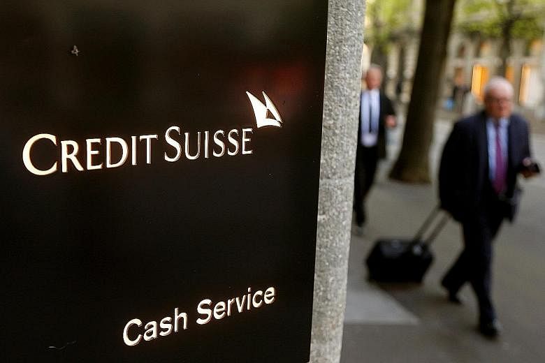 Credit Suisse on Friday sought to quell an outcry over compensation by proposing to lower bonuses for top executives and to freeze pay for the board of directors. Executives are offering to forgo 40 per cent of their bonuses.