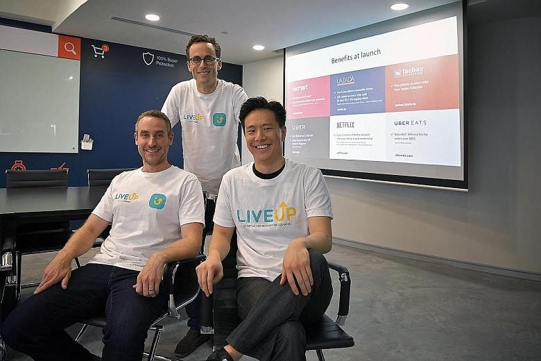 (From left) RedMart chief executive and co-founder Roger Egan, Lazada Singapore chief executive Alexis Lanternier and general manager of Uber Singapore Warren Tseng at the launch of membership programme LiveUp at the Lazada office yesterday.